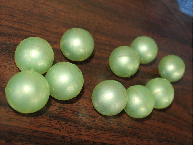 Polyurethane coated iron core grinding ball