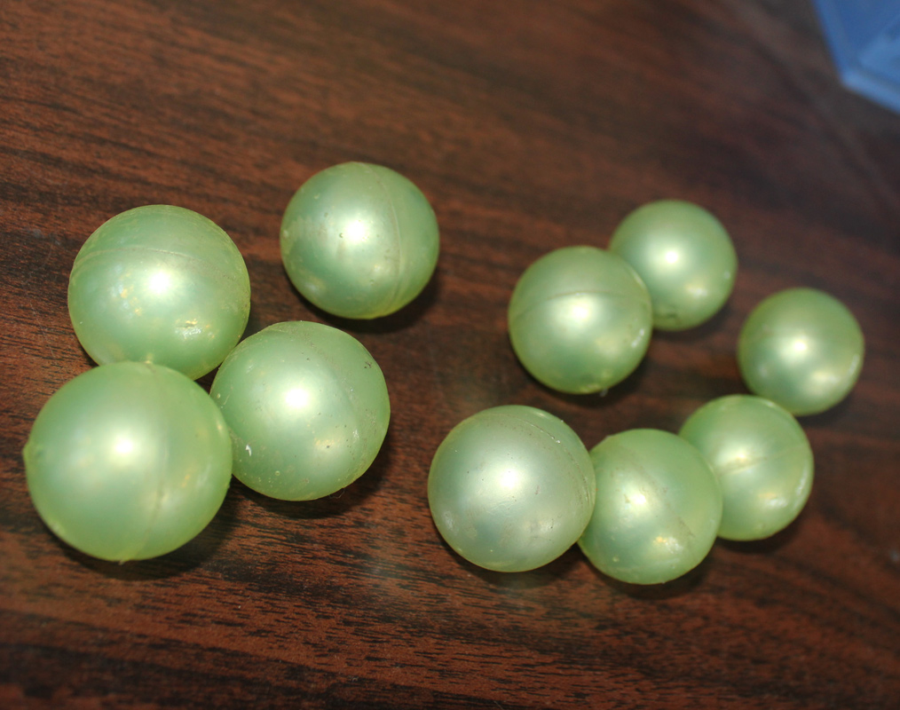 Polyurethane coated iron core grinding ball